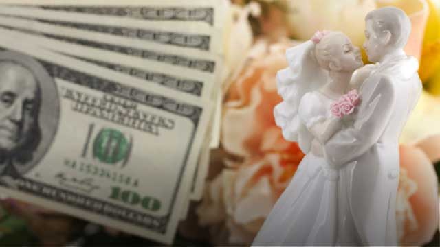 Money and a cake topper